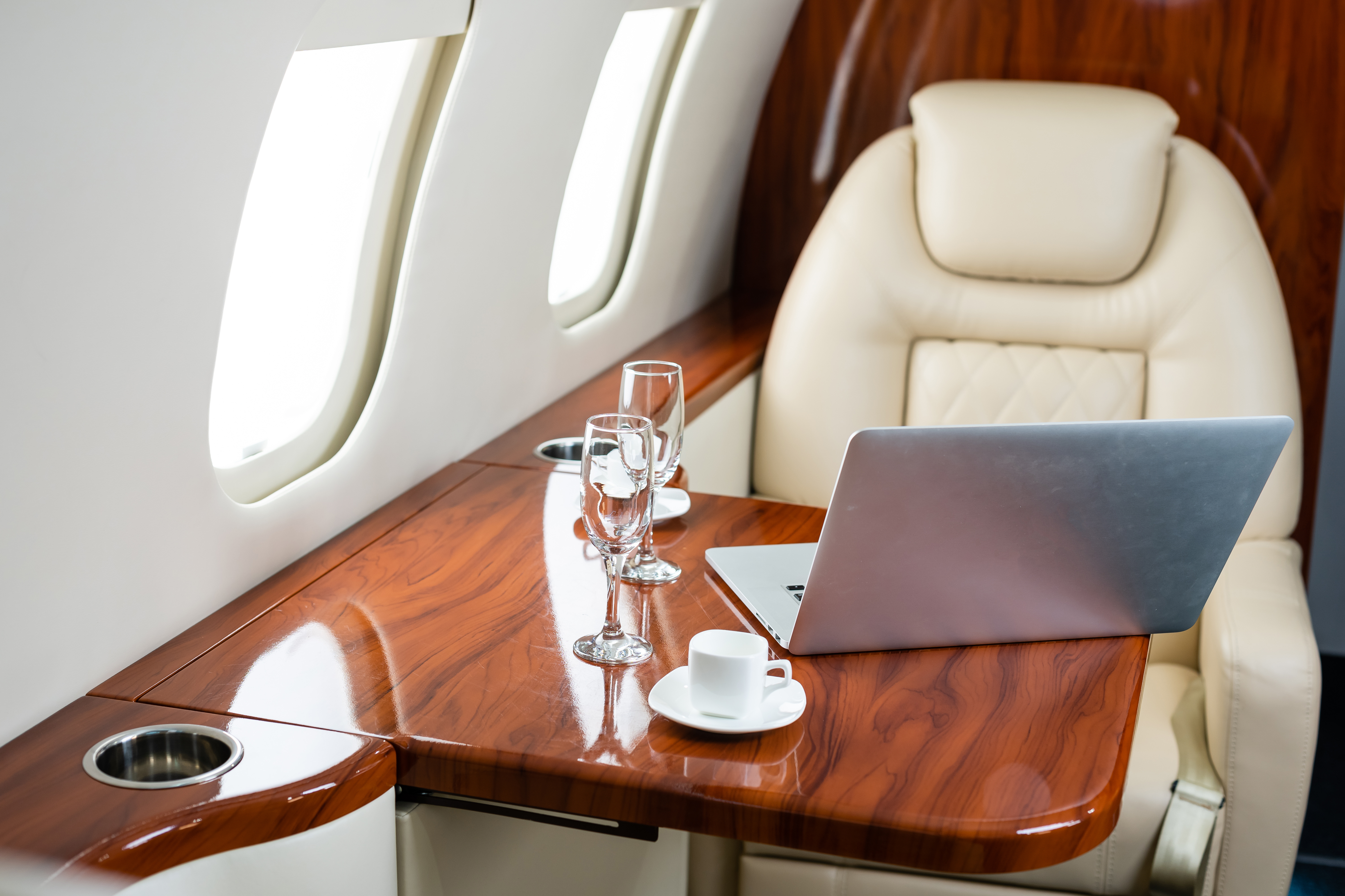 interior of private plane with laptop